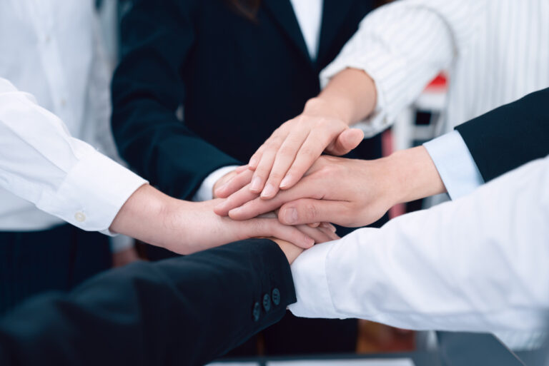 Members joining hands